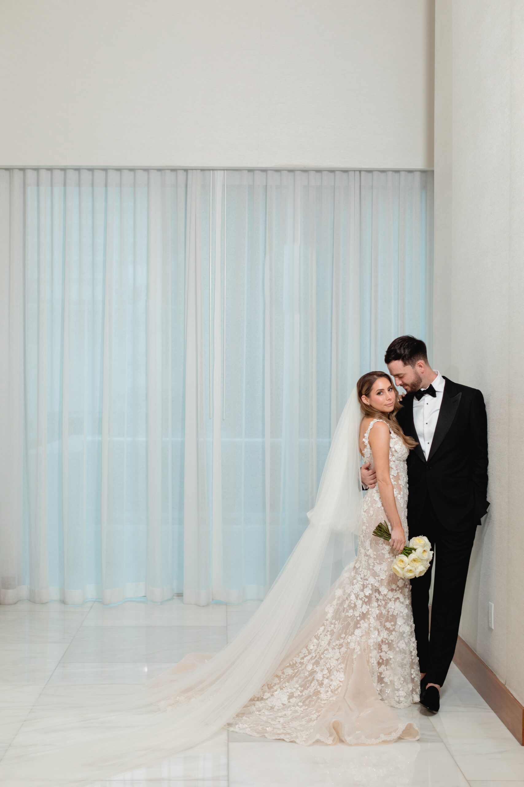 Sophisticated Bride and Groom Embrace at Conrad Fort Lauderdale Wedding