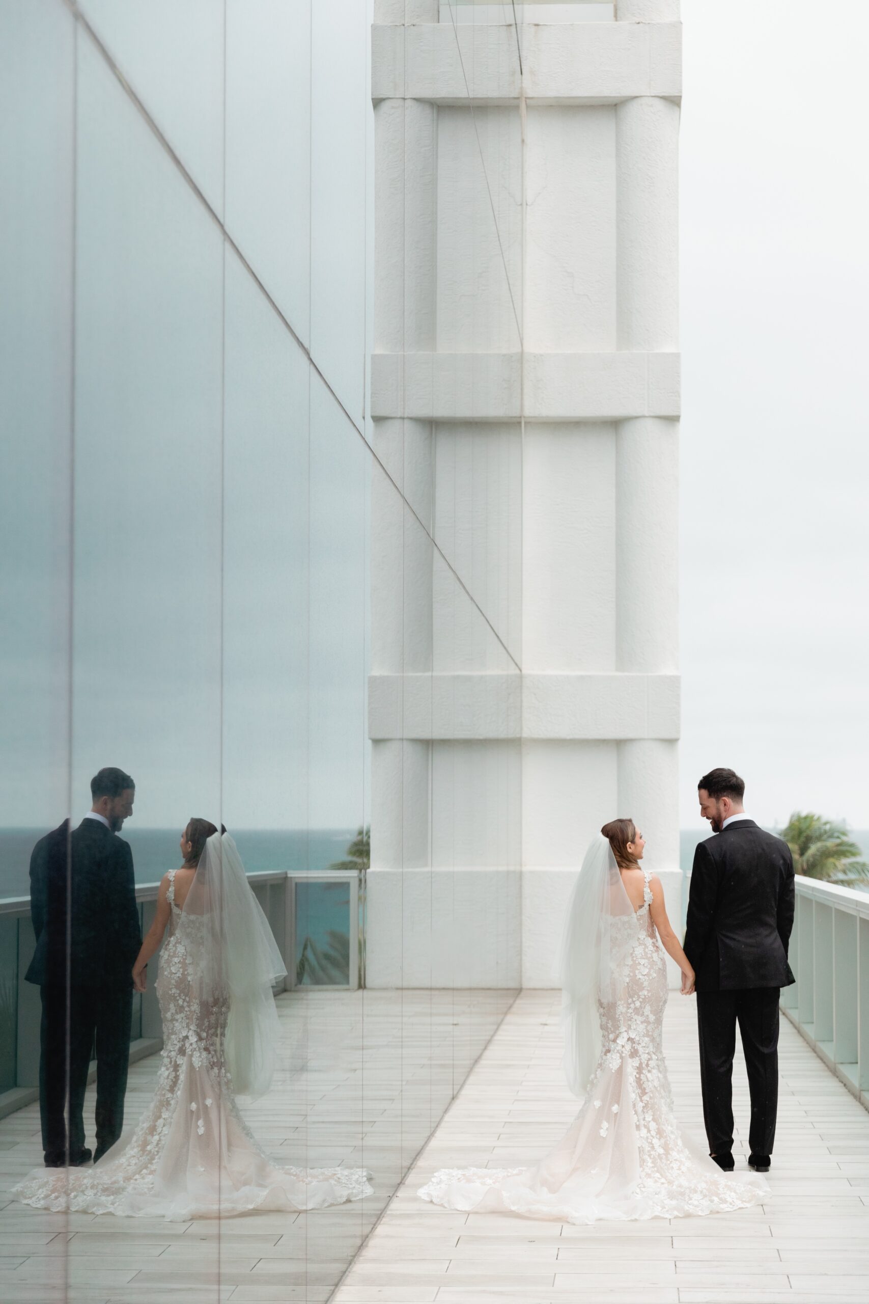 Bride and Groom Walking on Balcony Terrace at Conrad Fort Lauderdale