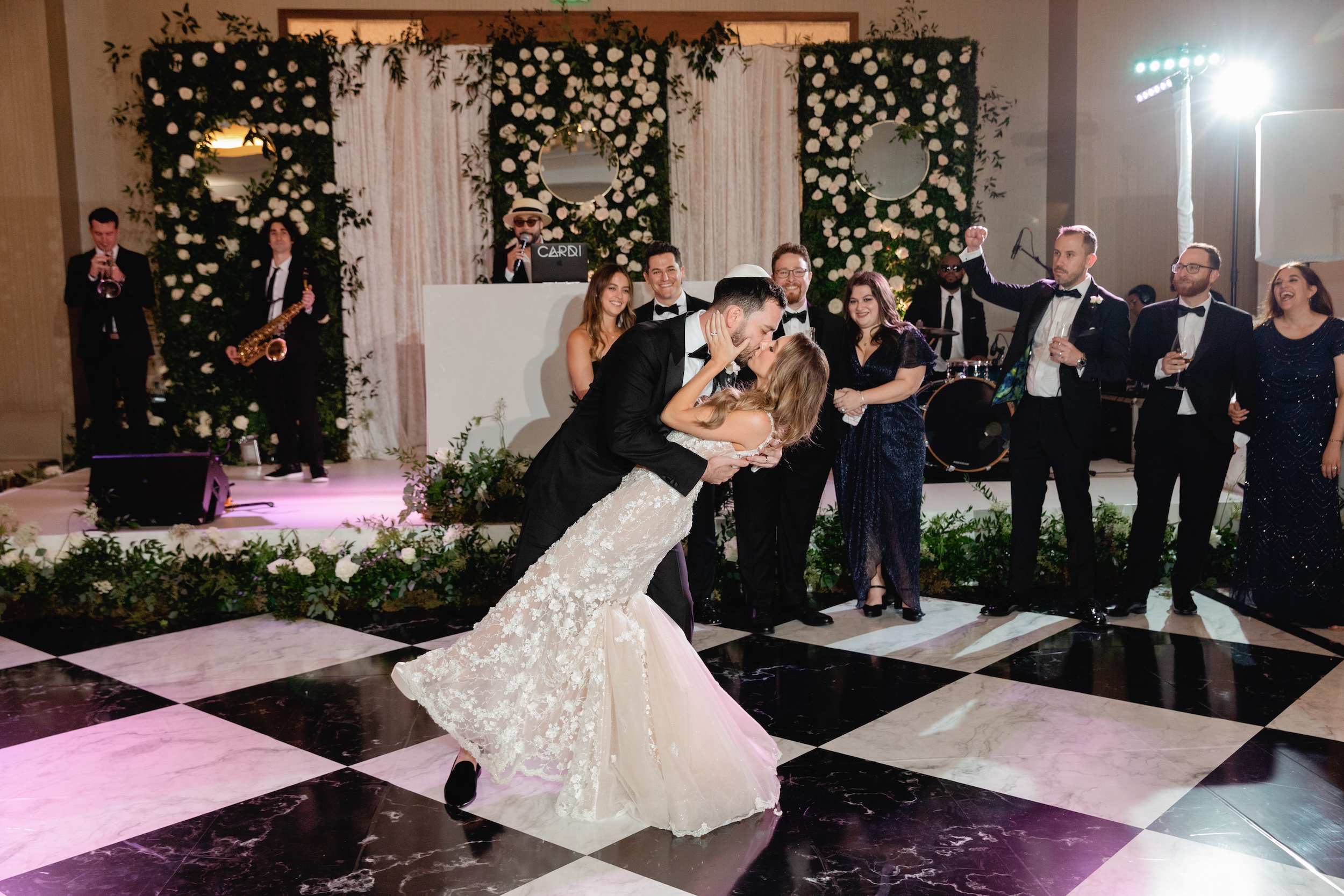 Bride and Groom Kiss on Checkered Dance Floor at Conrad Fort Lauderdale Wedding
