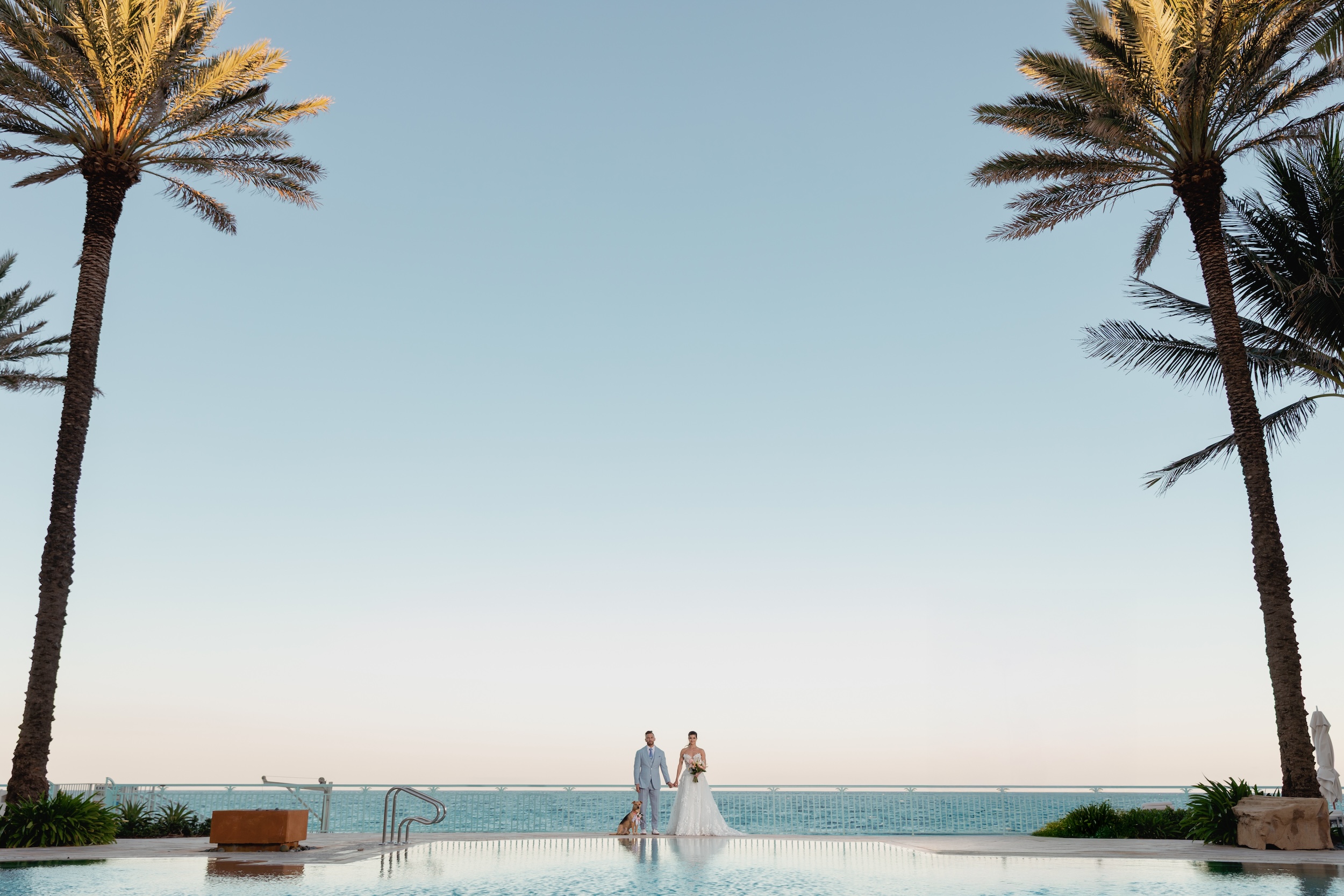 Bride and Groom Holding Hands at EAU Palm Beach Wedding