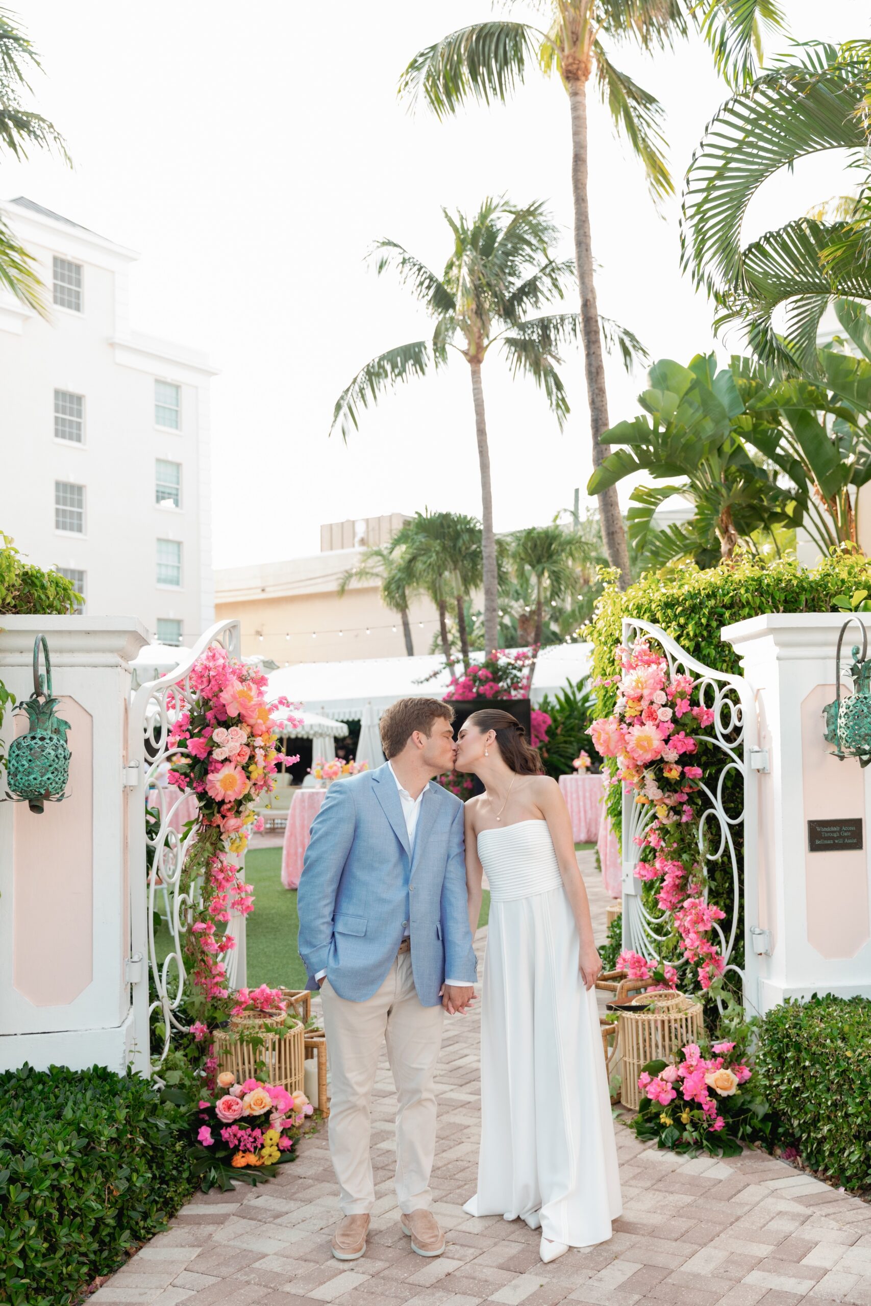 Bride and Groom Kiss at Gates at The Colony Hotel