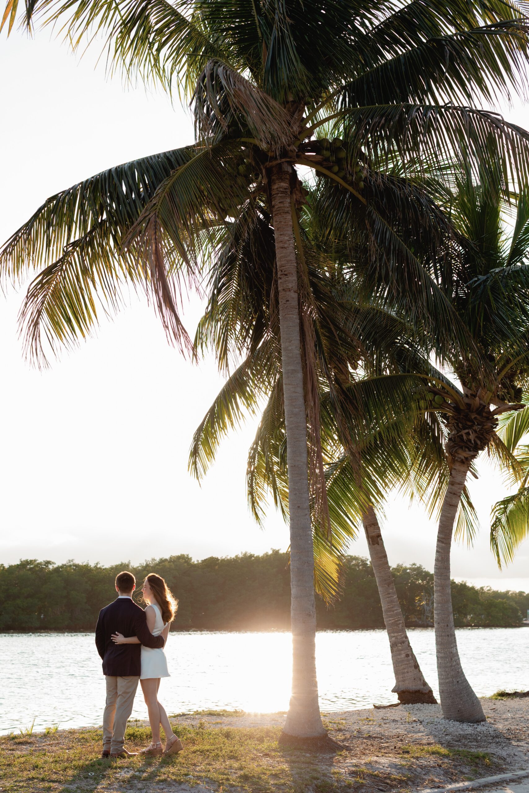 Couple Embraces, Watching Sunset During Matheson Hammock Park Engagement Photography